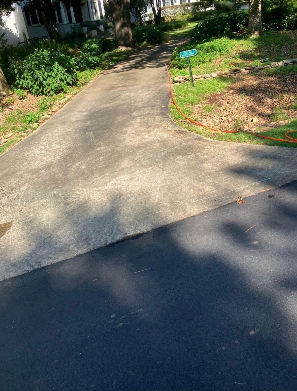 Concrete residential driveway before professional pressure washing