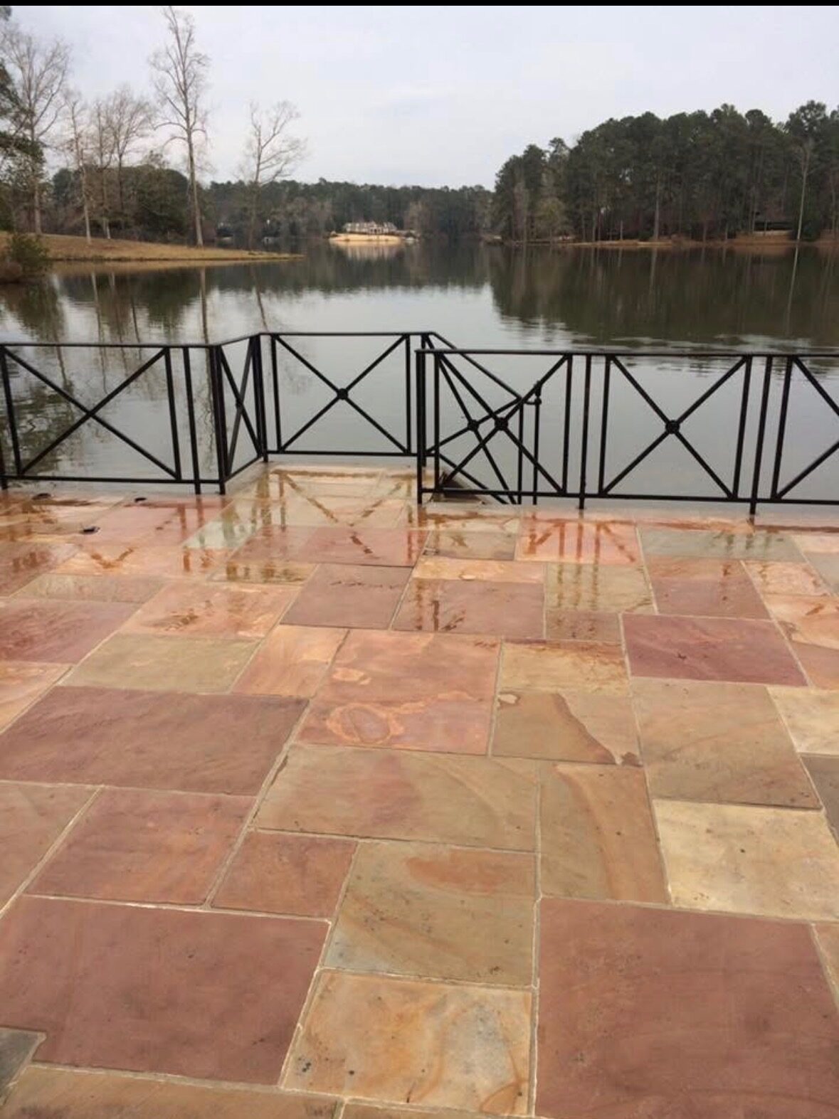 Clean lakeside natural-stone patio after professional washing