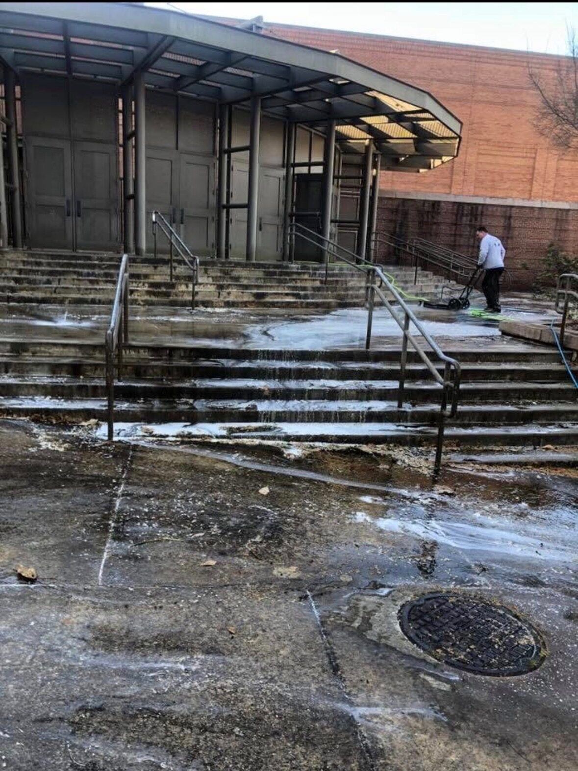 Commercial venue entrance before professional exterior cleaning